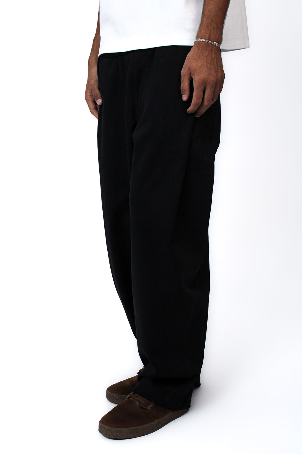 Pleated Balloon-Fit Pants in Black, three-quarter view