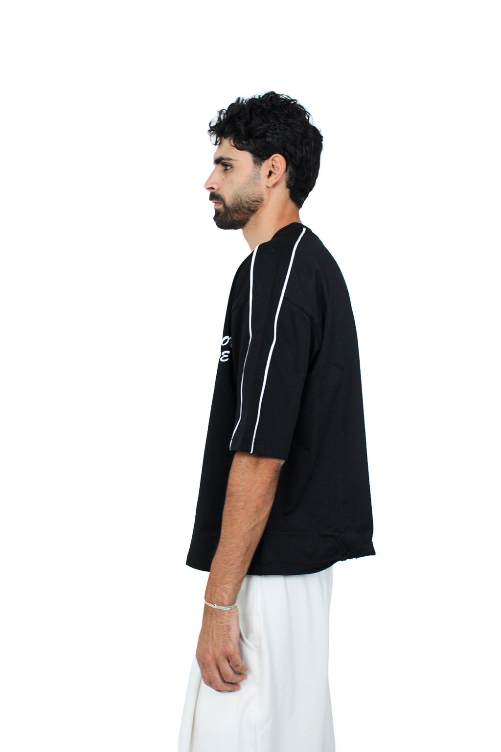 Piped Boxy Tee in Black, three-quarter view on model