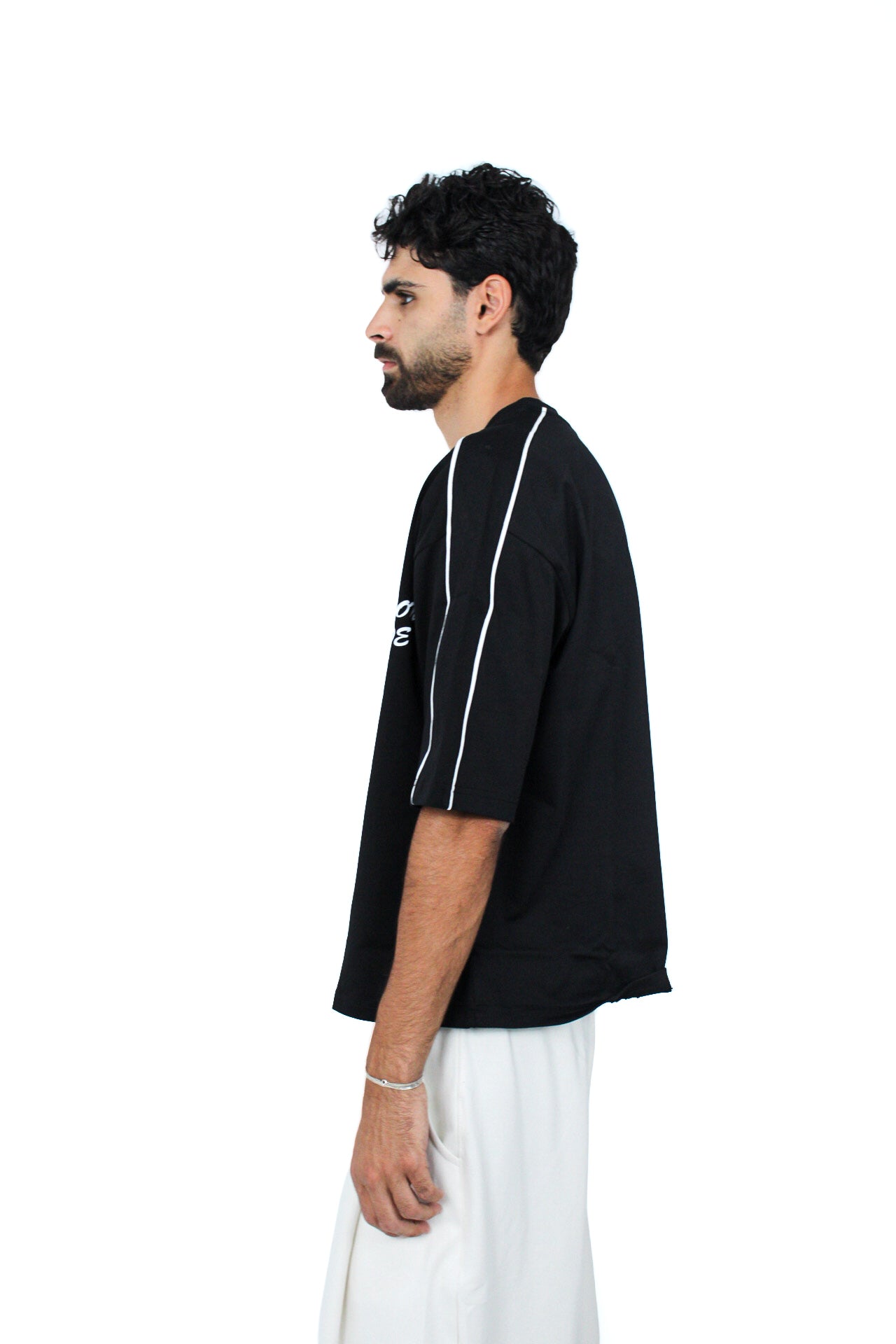 Piped Boxy Tee in Black, three-quarter view on model