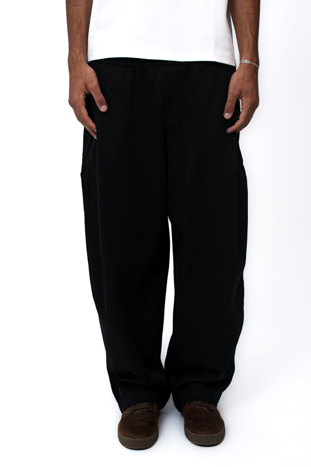 Pleated Balloon-Fit Pants in Black, front view on model